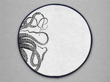 Load image into Gallery viewer, black kraken squid octocpus tenticles print on a beige linen circular aga cover with black hemming.. Mustard and Gray