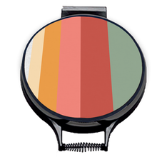 Load image into Gallery viewer, Stripes of green, red, pink and orange on beige linen circular aga cover with black hemming. Aga chef's pad hob cover. Pictured on metal aga lid on an isolated background. Mustard and Gray