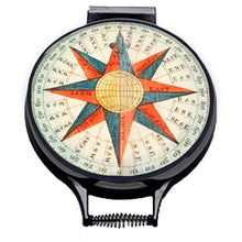 Load image into Gallery viewer, vintage compass print with red and blue detail printed on a beige linen circular aga cover with black hemming. Pictured on metal aga lid on an isolated background. Mustard and Gray