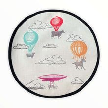 Load image into Gallery viewer, Farm High Life cow, sheep, horse and pig sketch drawings with colourful hot air balloons print on a beige linen circular aga cover with black hemming. Mustard and Gray