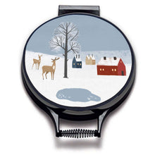 Load image into Gallery viewer, winter fox scandi modern print on a beige whith village scene including blue sky, , deer houses and pond linen circular aga cover with black hemming. Pictured on metal aga lid on an isolated background. Mustard and Gray
