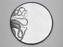 Load image into Gallery viewer, black kraken squid octocpus tenticles print on a beige linen circular aga cover with black hemming.. Mustard and Gray
