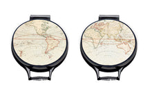 Load image into Gallery viewer, Set of two. vintage atlas world map print on a beige linen circular aga cover with black hemming. Pictured on metal aga lid on an isolated background. Mustard and Gray
