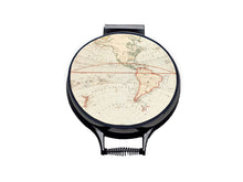Load image into Gallery viewer, vintage atlas world map print on a beige linen circular aga cover with black hemming. Pictured on metal aga lid on an isolated background. Mustard and Gray
