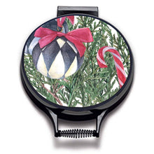 Load image into Gallery viewer, Illustration of Christmas tree bows with lack and white baubles with red bows, candy canes, oranges and xmas decorations on linen circular aga cover with black hemming. Pictured on metal aga lid on an isolated background. Mustard and Gray

