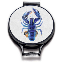 Load image into Gallery viewer, blue lobster watercolour painting on a beige linen circular aga cover with black hemming. Pictured on metal aga lid on an isolated background. Mustard and Gray
