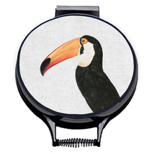 Load image into Gallery viewer, Set of two hob covers. Toco Toucan illustration print on a beige linen circular aga cover with black hemming. Pictured on metal aga lid on an isolated background. Mustard and Gray
